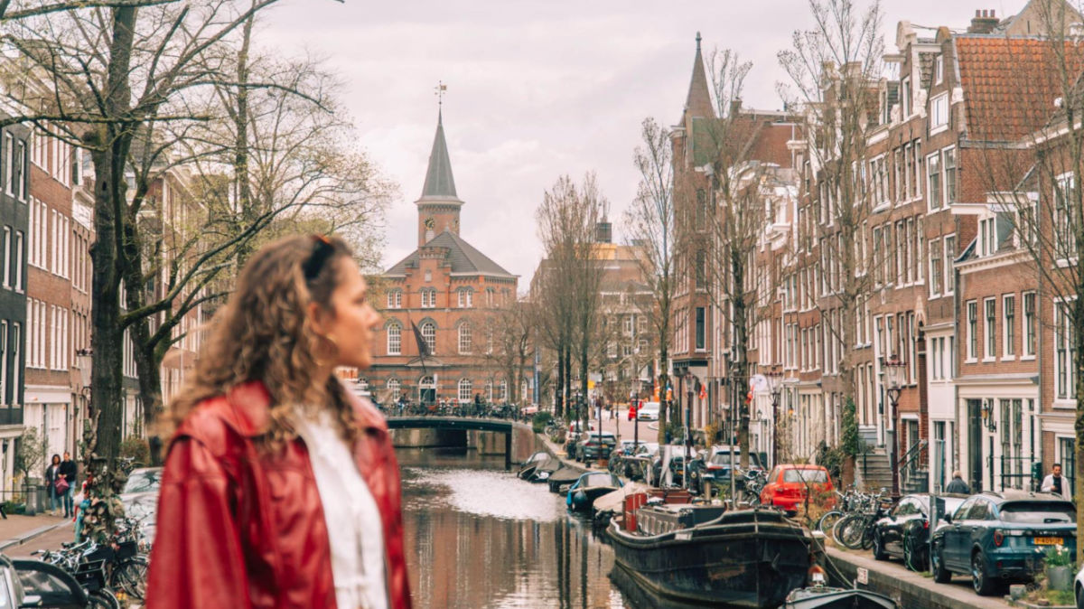 Author Amber looking at the canals in Amsterdam