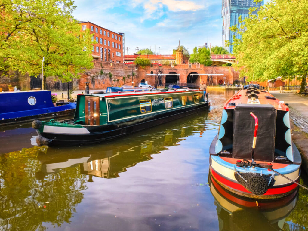 View of the colorful boats on the canals of Castlefield