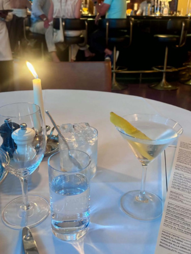 View of the candle-lit table with drinks in MARTINO’S