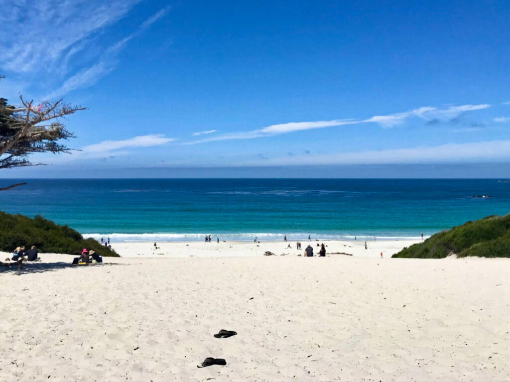 View of the vast white sand beach and the deep blue ocean and sky in Carmel-by-the-Sea