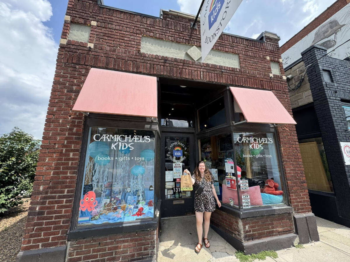 The author, Elizabeth Demolat smiling for a photo outside Carmichael’s Kids