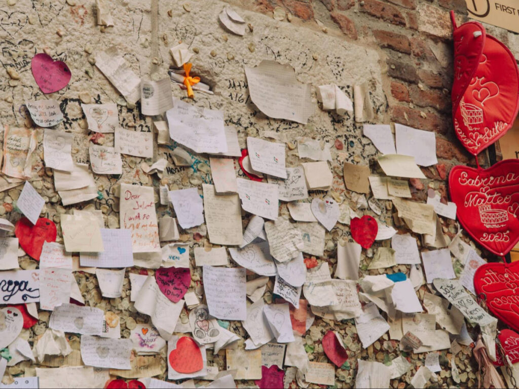 A wall filled with love letters to Juliet at the Casa di Giulietta
