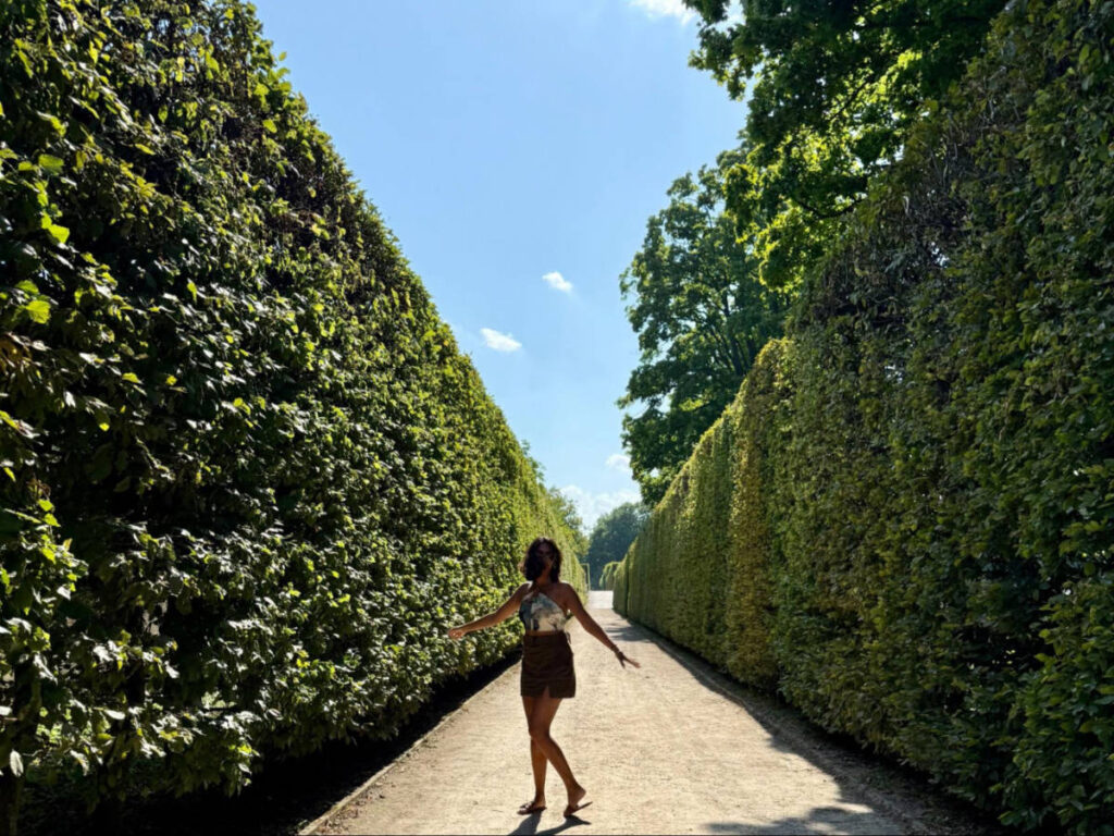 Author Meera strolling around the Castle gardens in Cesky Krumlov
