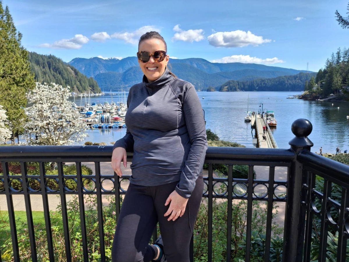 Travel Lemming writer Catherine Driver, posing for a photo at the Deep Cove with an overlooking view