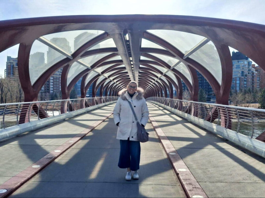 The author Catherine Driver, standing in the middle of Peace Bridge featuring it's architecture