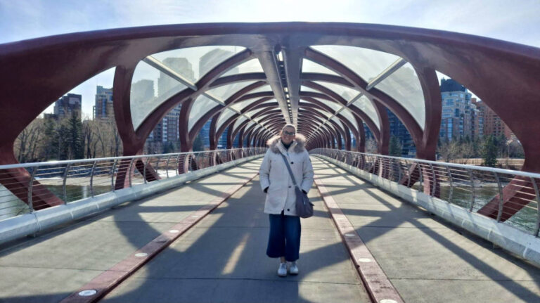 The author Catherine Driver, standing in the middle of Peace Bridge featuring it's architecture
