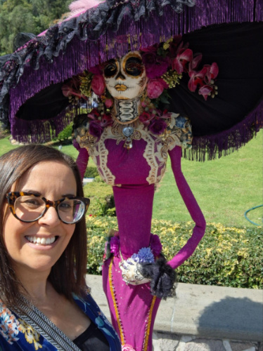 Travel Lemming writer Catherine Driver, smiling in front of the Catrina