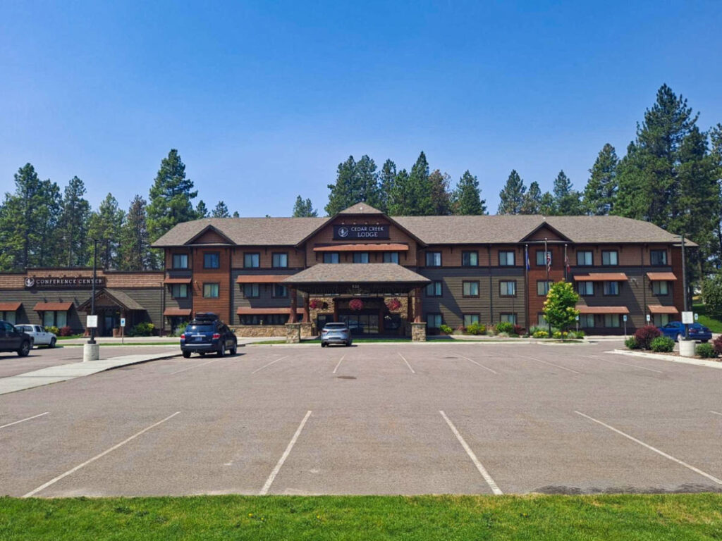 Exterior view of the Cedar Creek Lodge surrounded by greeneries