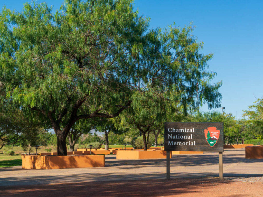 View of the Chamizal National Memorial Cultural Center sign surrounded by trees