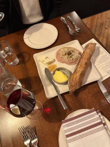 The charcuterie board with a glass of red wine