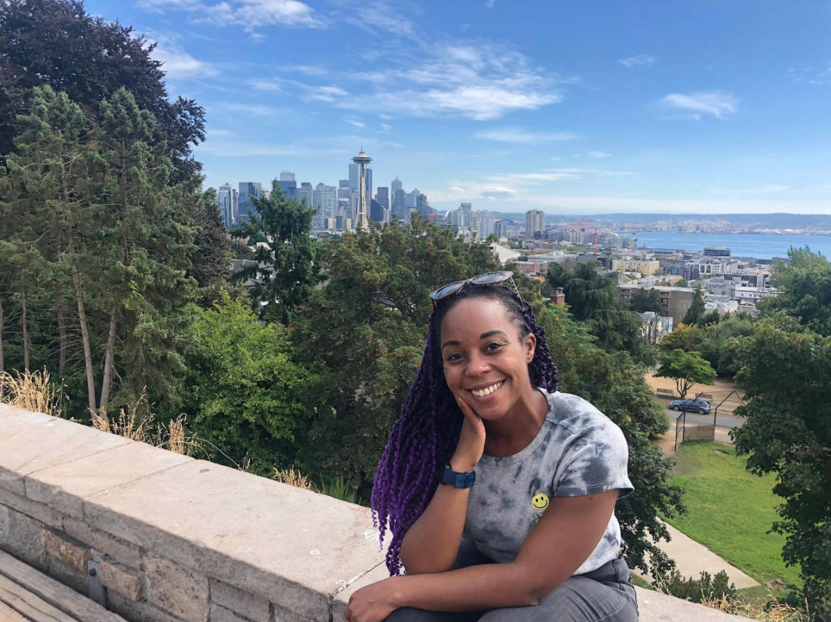 The author, Chelsea Booker smiling for a photo at Kerry Park