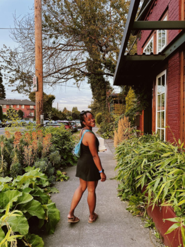 The author Chelsea Booker, walking along the street in Northeast Portland