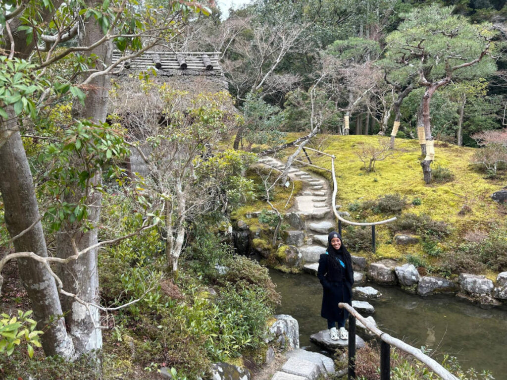 Travel Lemming Editor Chelsea Booker, standing on the pathway at the Isuien Garden