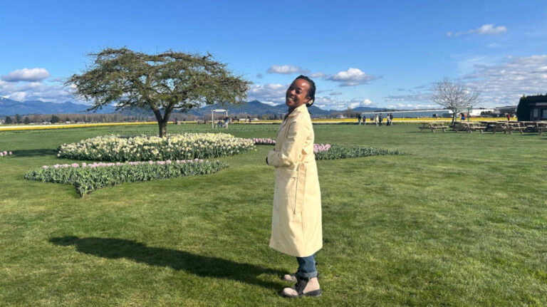 The author Chelsea Booker, enjoying the view and the daffodils in Skagit Valley