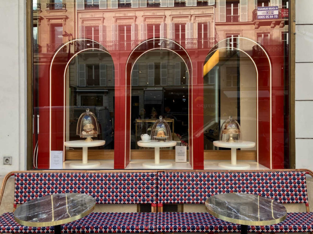 View of the chic exterior and interior of a Parisian restaurant