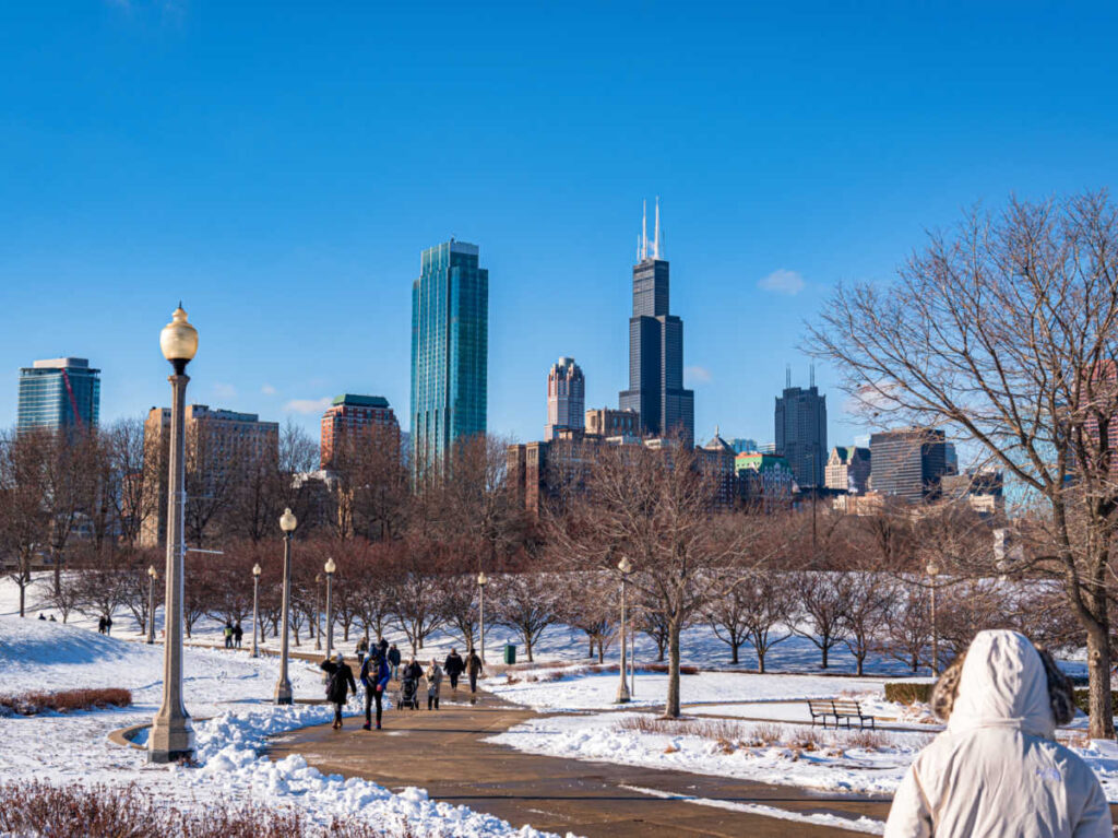 The par covered in snow with Chicago skyline view