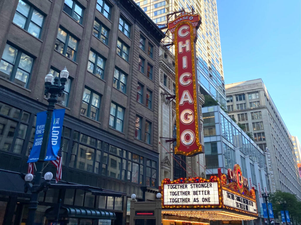 The exterior of Chicago Theatre with the marquee glitters red and gold