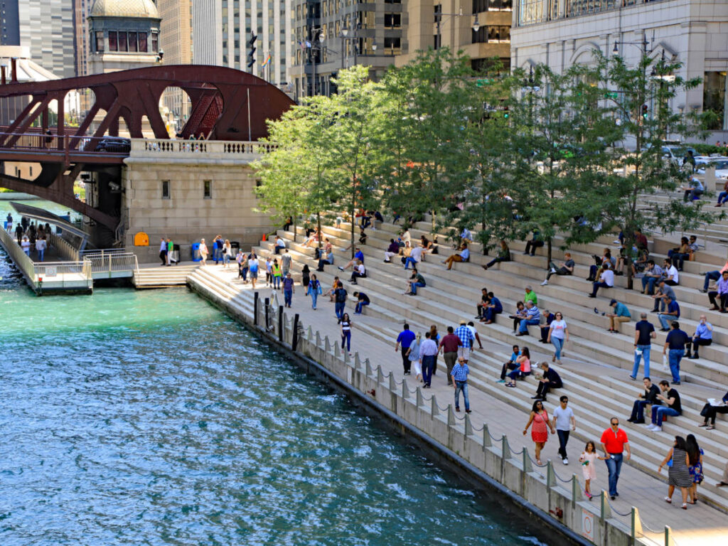 People enjoying Chicago's Riverwalk, along the Chicago River