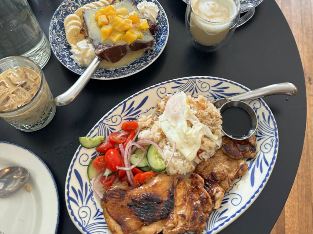 A breakfast spread with chicken inasal and mango banana french toast at Cebu Chicago