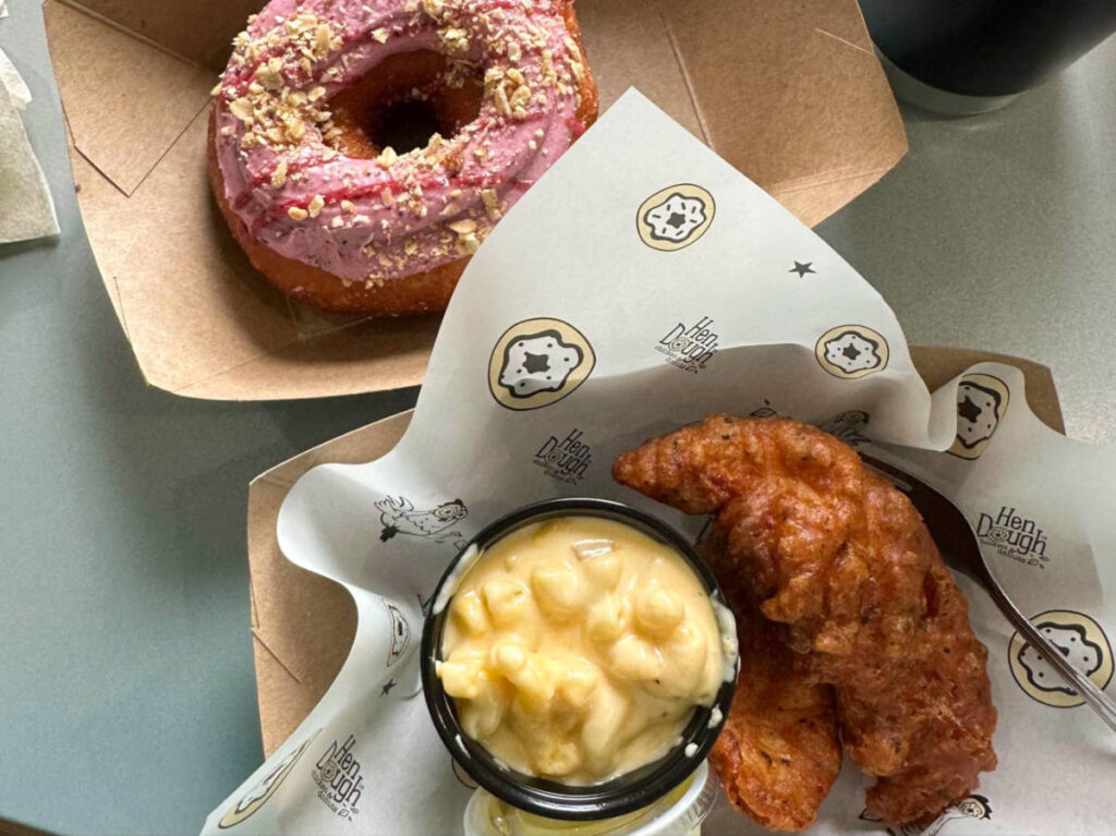 Closeup look of a doughnut and fried chicken with mac n cheese