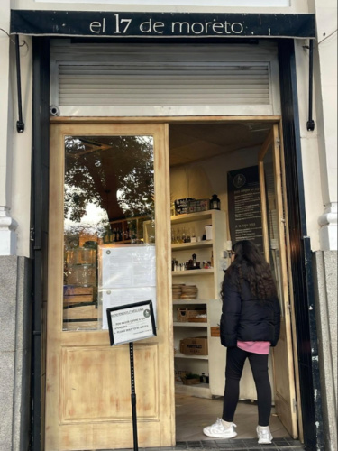 The author's daughter, entering the El 17 de Moreto restaurant