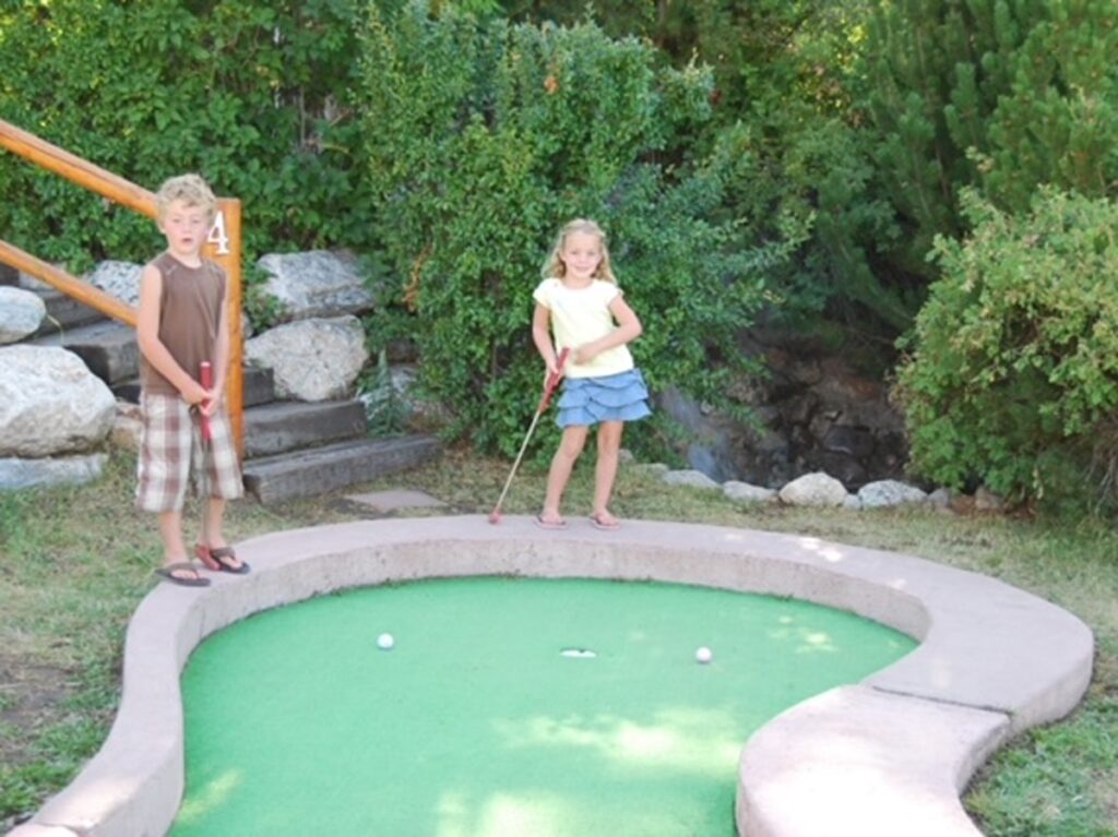 The children playing mini golf at Snow King Mountain Resort
