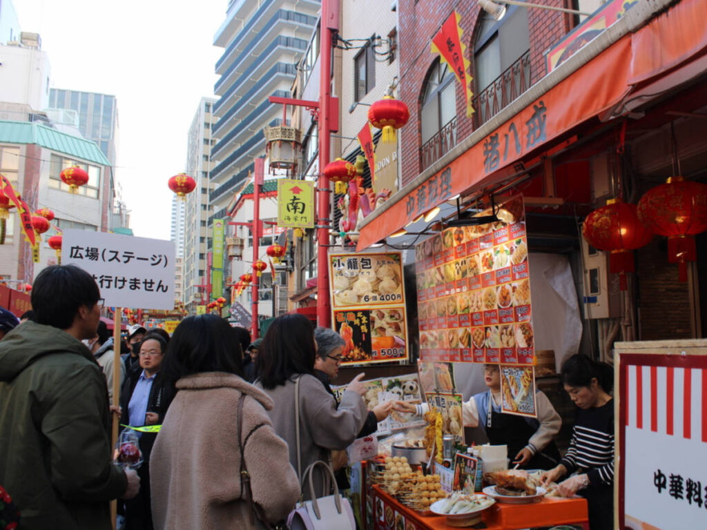 People buying food during the Chinese New Year in Kobe, Japan