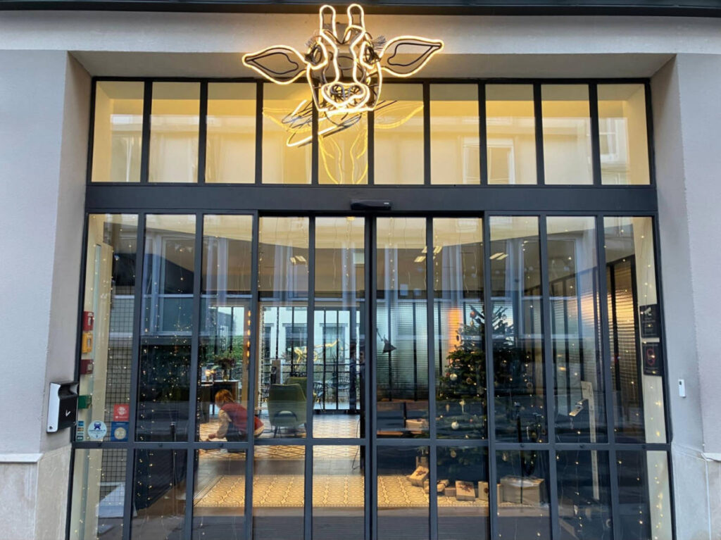 The Christmas decorations seen from the outside of Hôtel les Deux Girafes