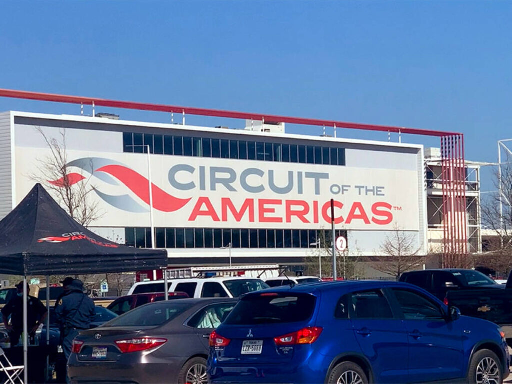 Cars parked outside the Circuit of the Americas
