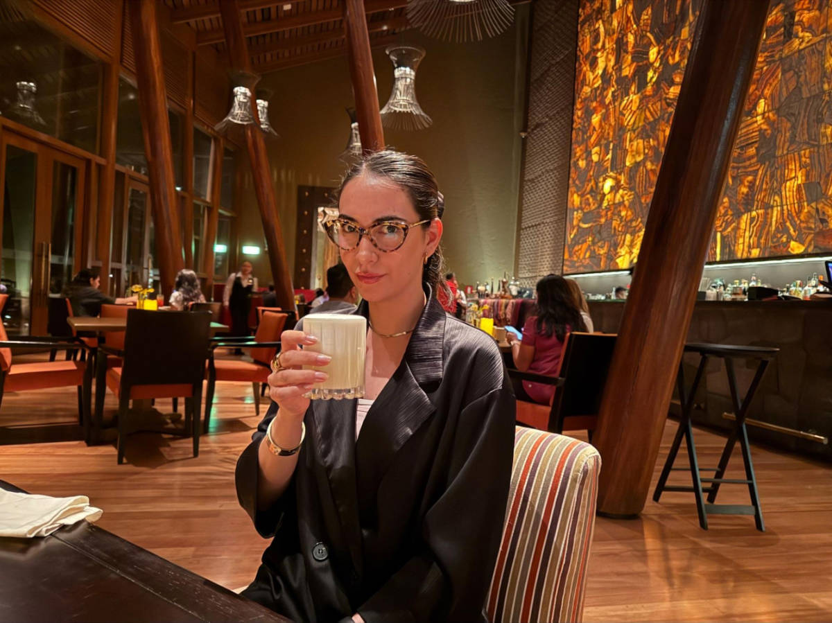 Clara trying a Pisco Sour at Kiri Bar