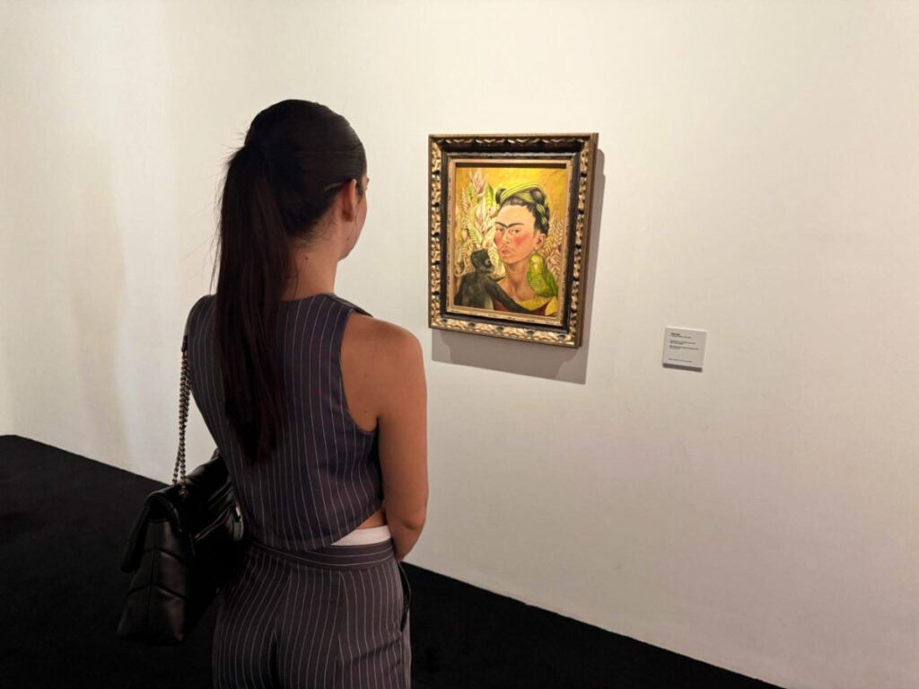 Clara Kesseler looking at the painting inside MALBA