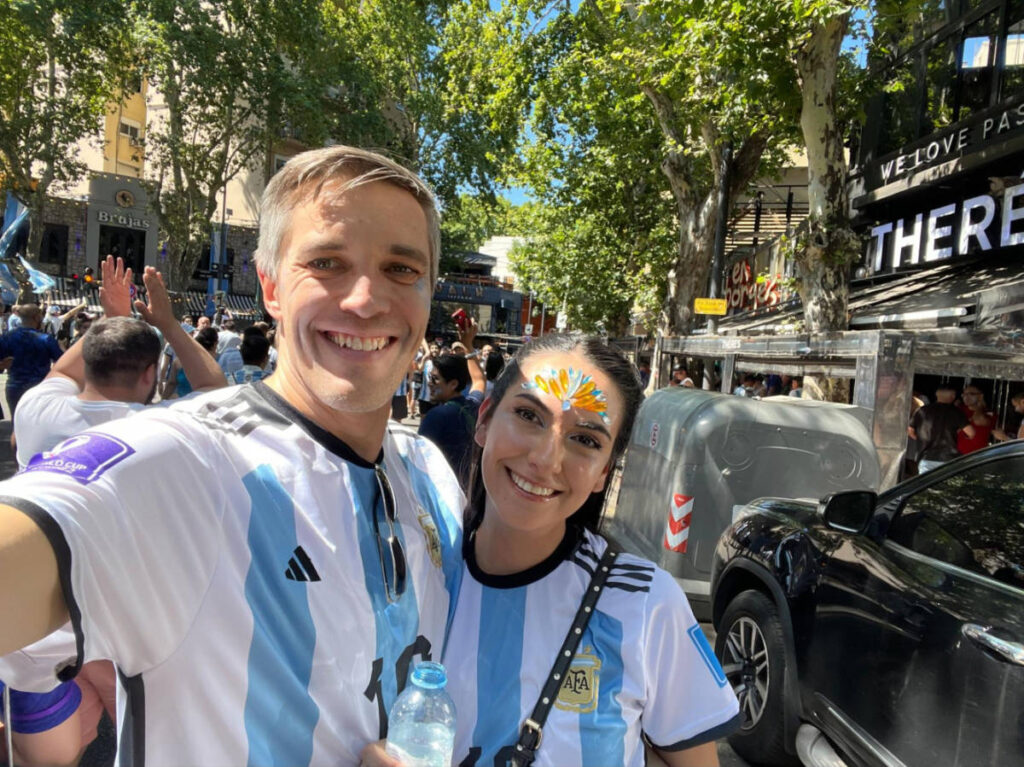 Travel Lemming founder, Nate Hake and Clara Kesseler, smiling for a photo at the Argentina’s World Cup victory celebration in Plaza Serrano