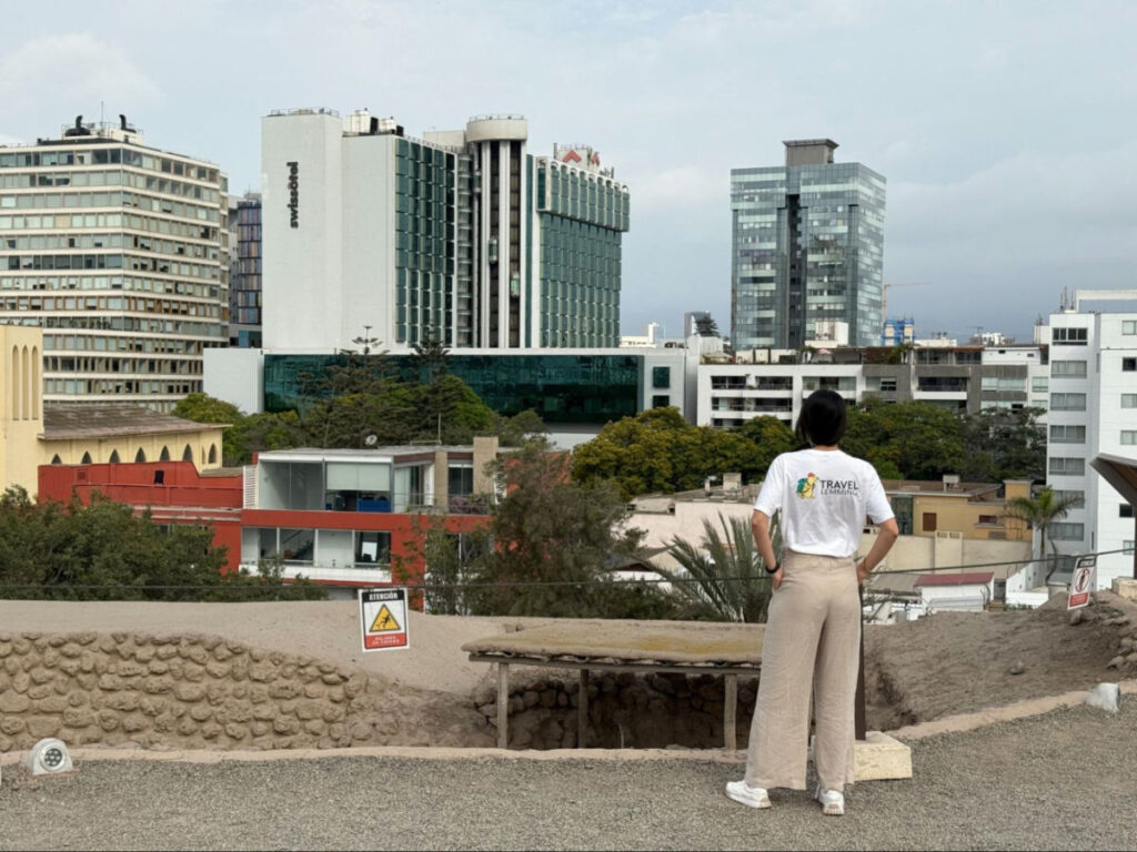 Writer Clara looking over San Isidro from atop the Huaca Huallamarca pyramid