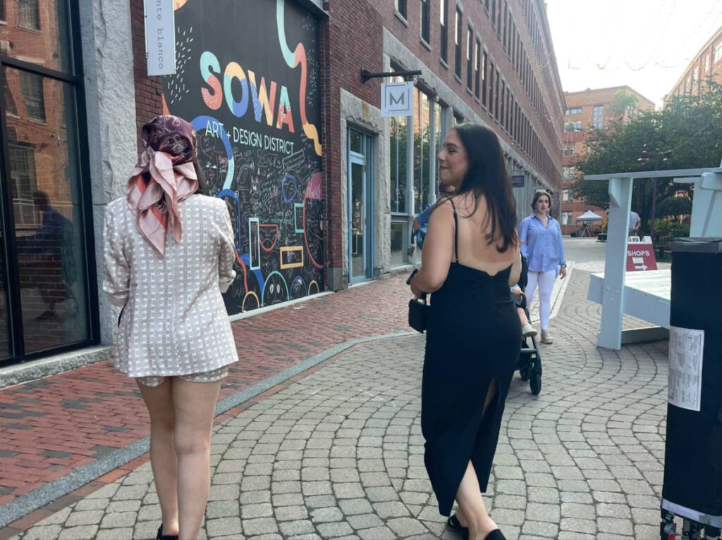 The author Claudicet Peña and her sister walking along the SOWA Open Market