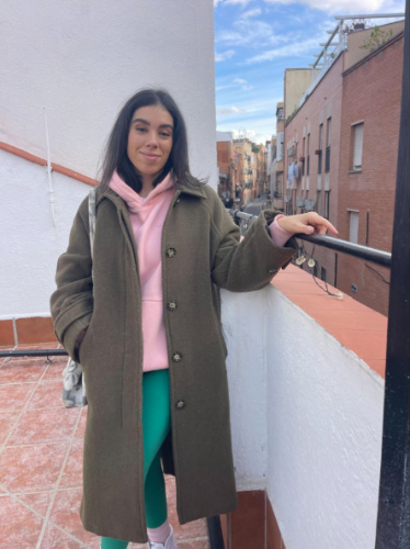 The author Claudicet Pena, smiling for a photo at the Airbnb’s private rooftop