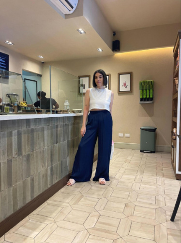 The author Claudicet Pena, posing for a photo inside the Vita Place