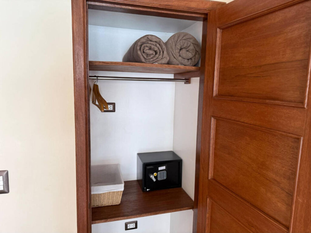 Towels and safe inside a cabinet on a room at the Jaya Machu Picchu Boutique Hotel