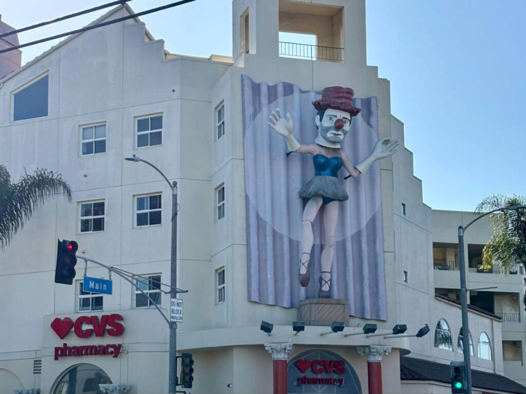A clown sculpture in front of the CVS