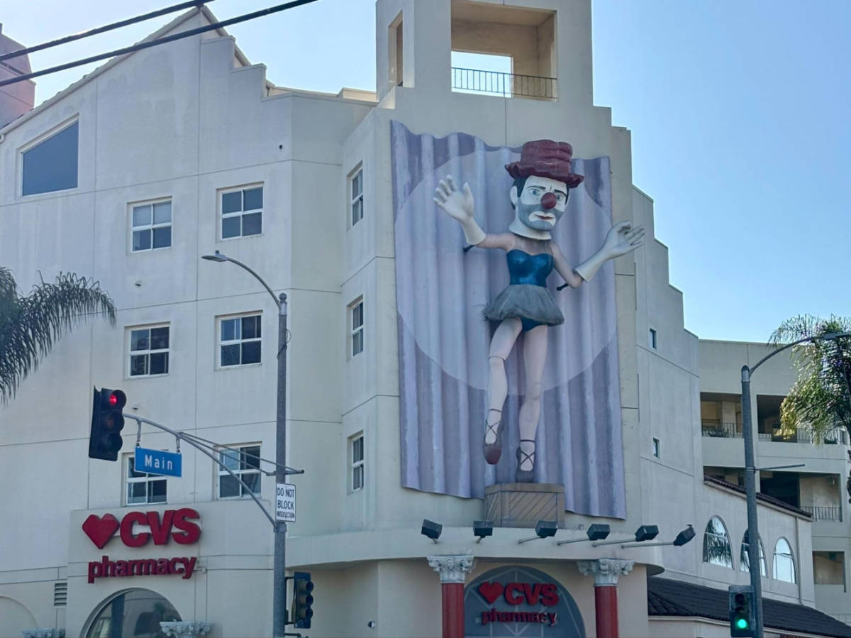 A clown sculpture in front of the CVS 