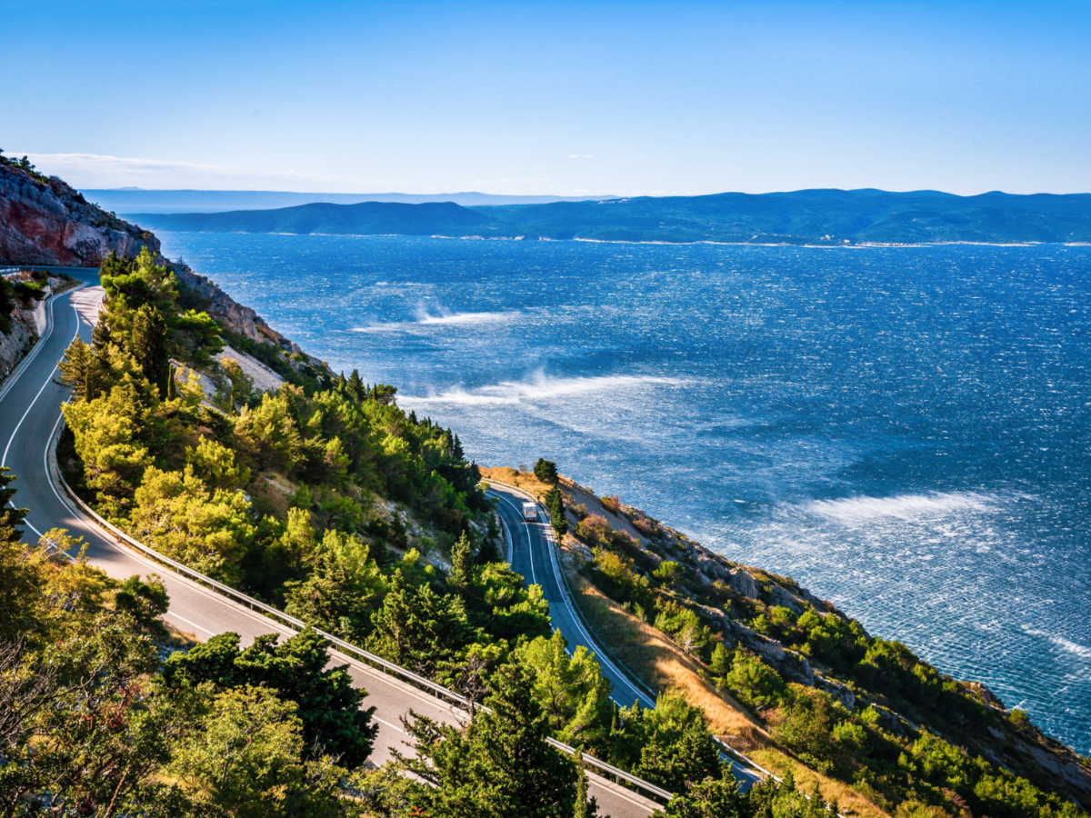 Overlooking view of the coastal roads surrounded by greenery