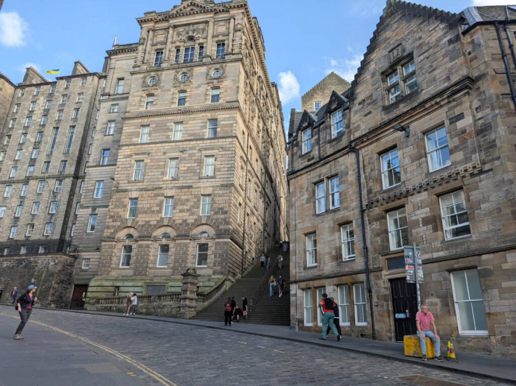 View of the cobblestone streets and stairs in between the buildings in Scotland