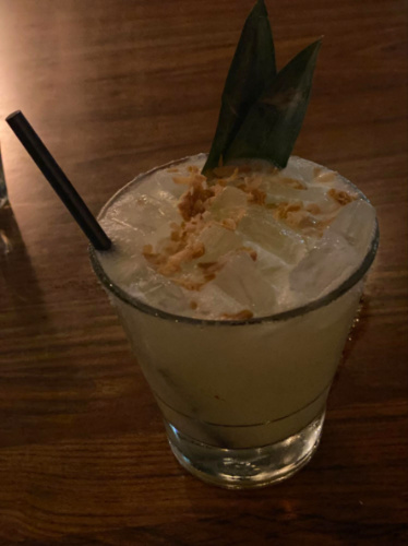 Top view of Toasted coconut and pineapple cocktail at Le Papagayo