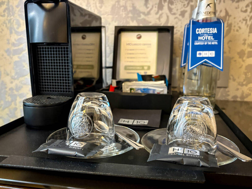 The coffee maker, glasses and complimentary water