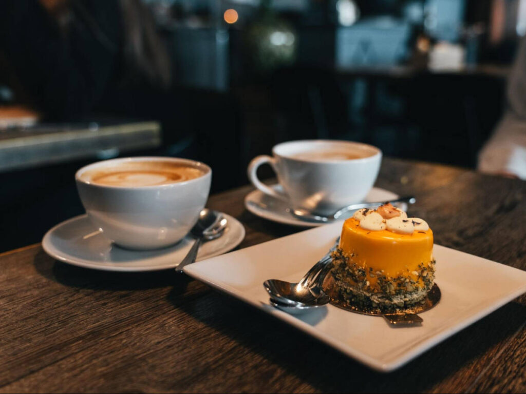 A plate with dessert and two cups of coffee from Fika at Fotografiska