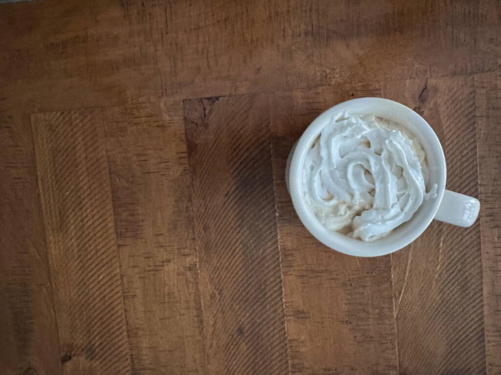 A cup of coffee on the wooden table