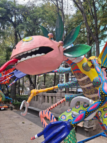 A colorful art sculpture of an insect