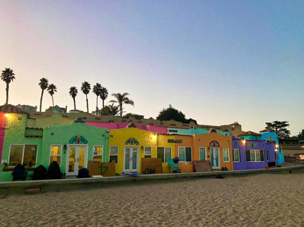 View of the lined colorful cottages on Capitola Beach at dusk