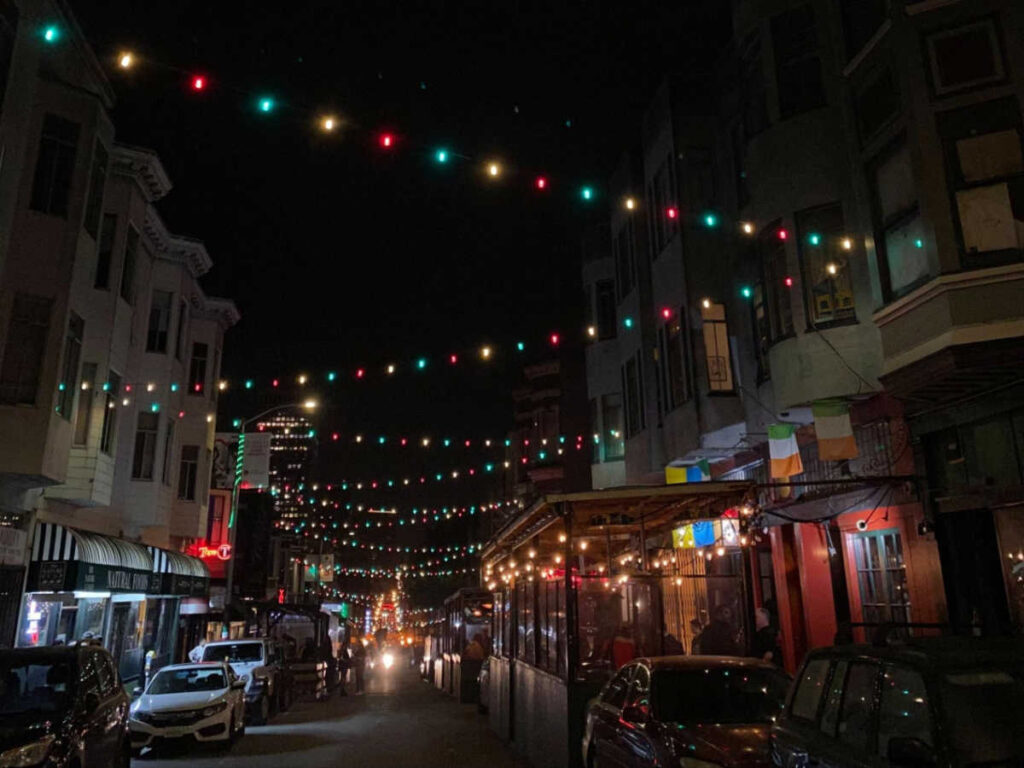 View of the colorful lights hanging above the street at the North Beach