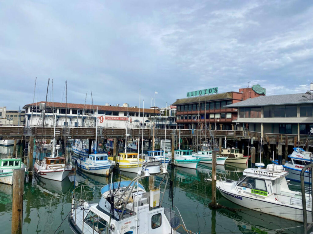 View of the colorful old fishing boats at the Fisherman’s Wharf harbor