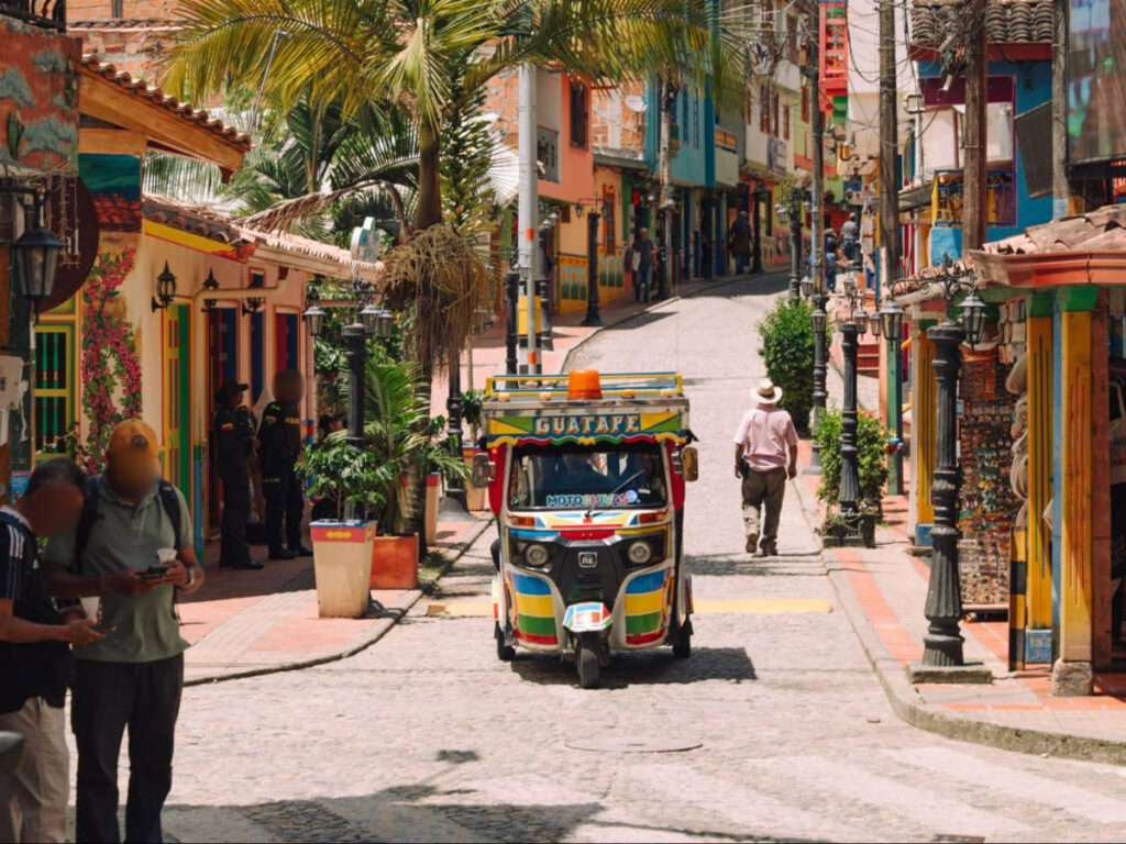 View of the colorful streets and tuk-tuks of Guatapé